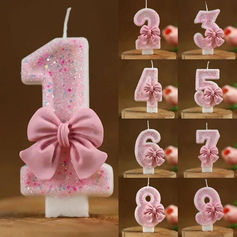 Pink glitter number candles 1 through 8 with bow decorations for birthday cake decoration