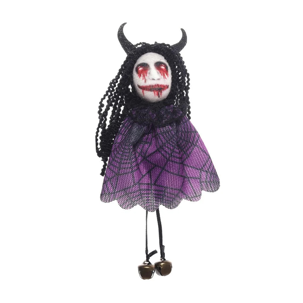 A dark witch ornament featuring black hair, purple fabric, and a gruesome face with red paint.