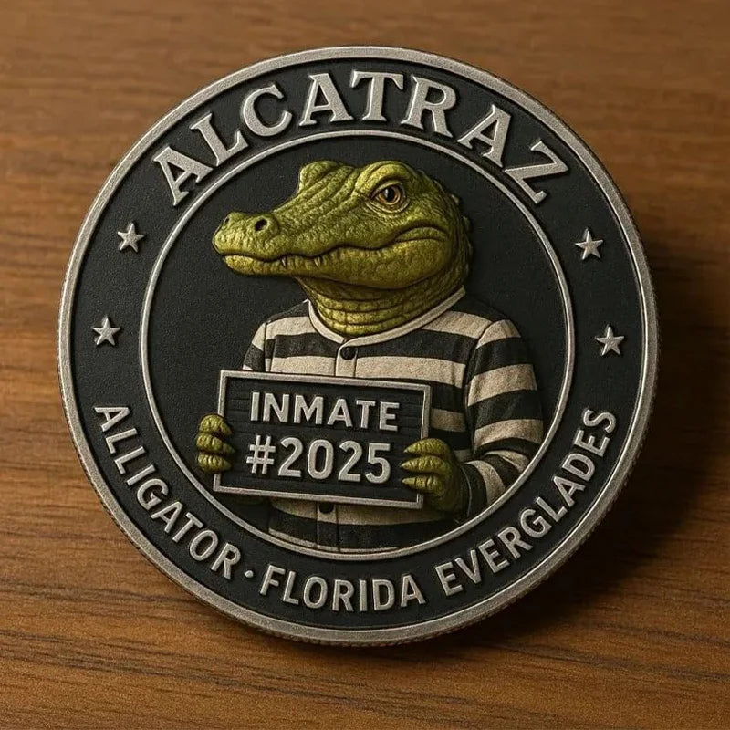 A round collectible coin featuring a green alligator head and the text Alcatraz and Alligator Florida Everglades.