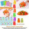 A silicone candy mold kit with various colored molds and droppers used for making candies.