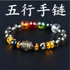 A close-up of a black crystal bracelet featuring various colored and clear stones.