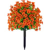 A bouquet of bright orange artificial eucalyptus violet flowers displayed in a black vase.