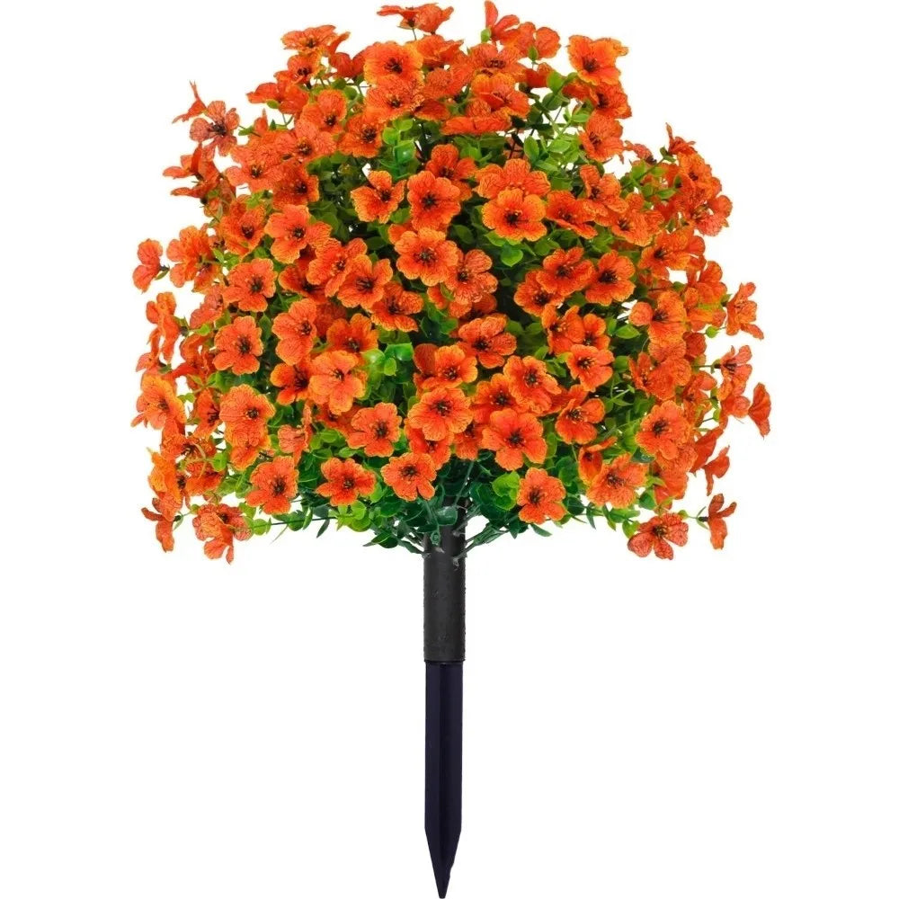 A bouquet of bright orange artificial eucalyptus violet flowers displayed in a black vase.