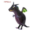 A black cartoon farm animal foil balloon with green accents and a horn.