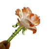 Handcrafted blue glass flower sculpture with orange petals and green stem
