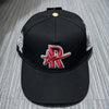 Black baseball cap embroidered with a red star logo and silver detailing