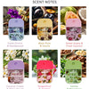 A collection of six moisturizing hand sanitizer sprays in various colors and scents including violet orchid, black plum, swee