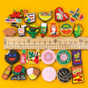 A collection of colorful Mexico style PVC shoe charms and accessories arranged on a yellow background.