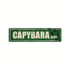 Vintage metal wall sign with the word CAPYBARA and BLVD in a distressed green background.