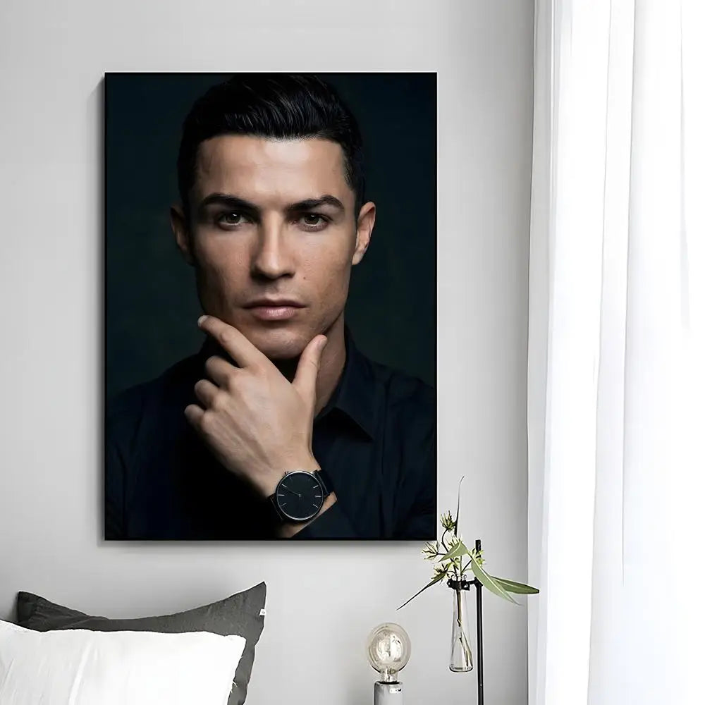 A portrait of Cristiano Ronaldo looking directly at the camera, wearing a dark shirt.