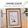 A framed wooden sign with the text Home is Where the is and a silhouette of a shoe inside.