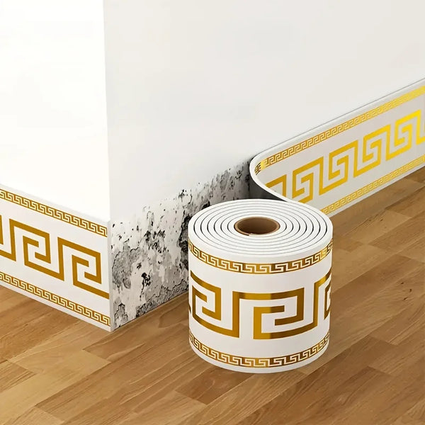Roll of self-adhesive PVC baseboard trim featuring a gold Greek key pattern and a gray brick texture.