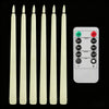 A set of six white tapered flameless LED taper candles and a control panel with timer and light settings.