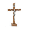 Handcrafted wooden crucifix with a corpus mounted on a cross and stand