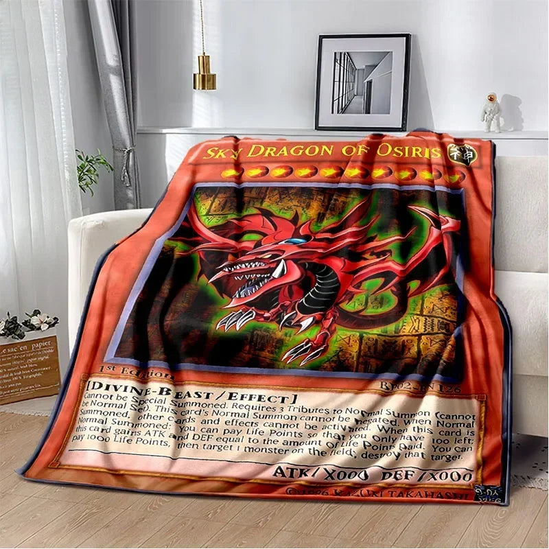 A red and orange throw blanket featuring a dragon design for the Blue-Eyes White Dragon Yu-Gi-Oh! card game.