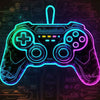 A glowing neon blue and pink video game controller is displayed against a dark, futuristic circuit board background.