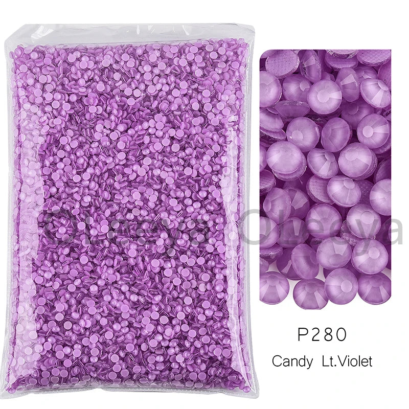 Bag of purple candy-like glass rhinestones in various sizes