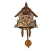 Vintage wooden cuckoo clock with an hourly chime featuring a detailed architectural facade and natural elements.