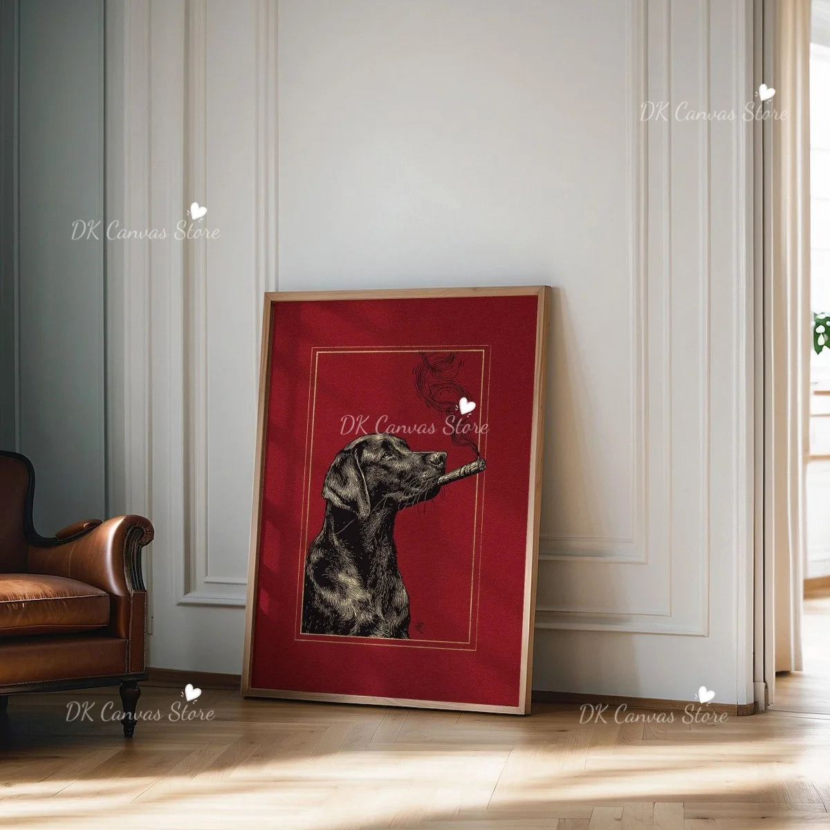 A framed canvas print featuring a black dog silhouette against a red background, displayed on a light-colored wall.