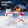 A white snowman figurine wearing a black top hat is placed on a mound of snow in an outdoor winter setting.