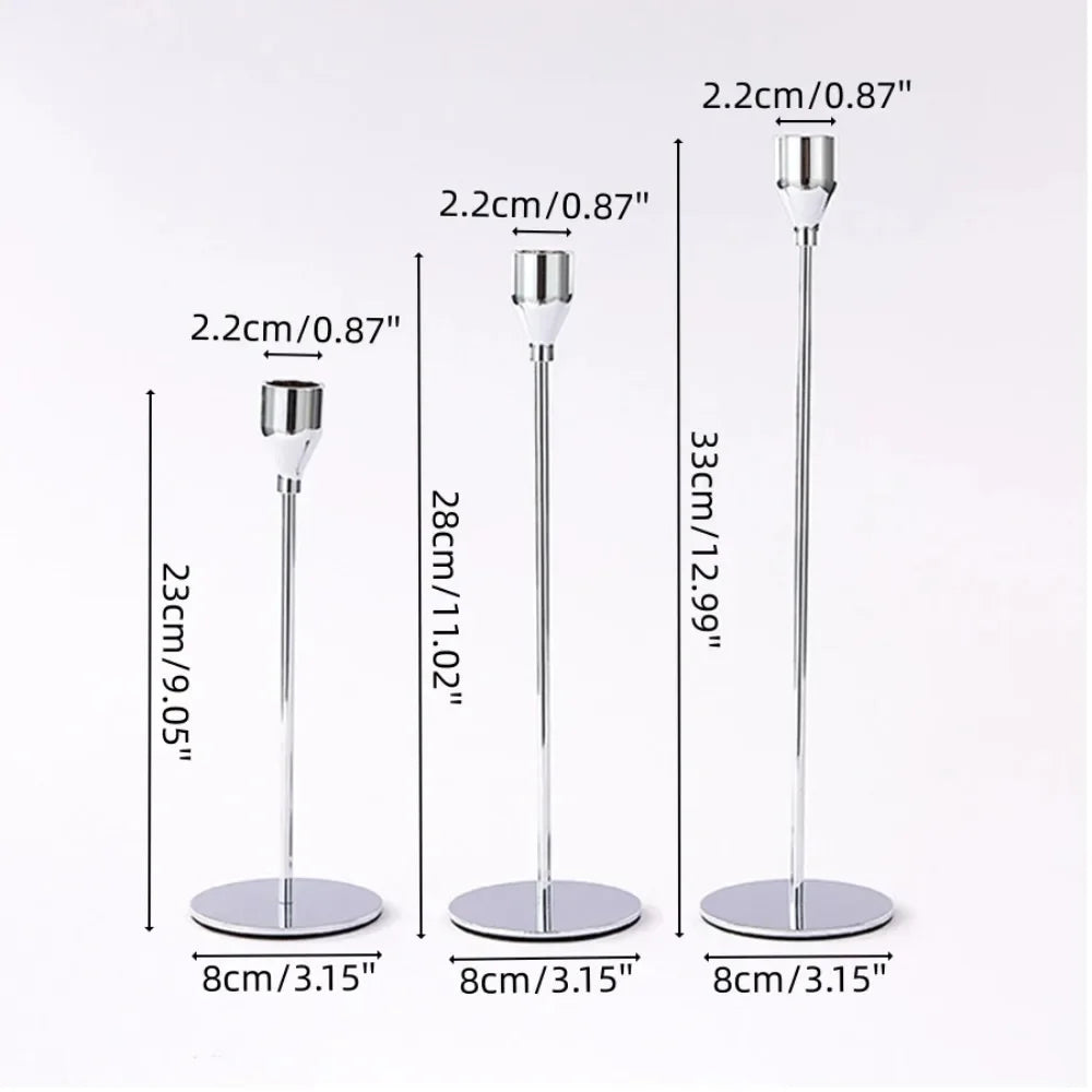 A set of three silver metal taper candle holders shown with various height options and bases.