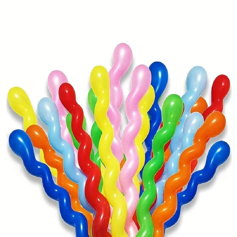 A bunch of colorful spiral latex party balloons in yellow, pink, blue, and orange.