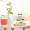 An inspirational acrylic desktop sign with the text You are absolutely incredibly amazing displayed on a wooden base.