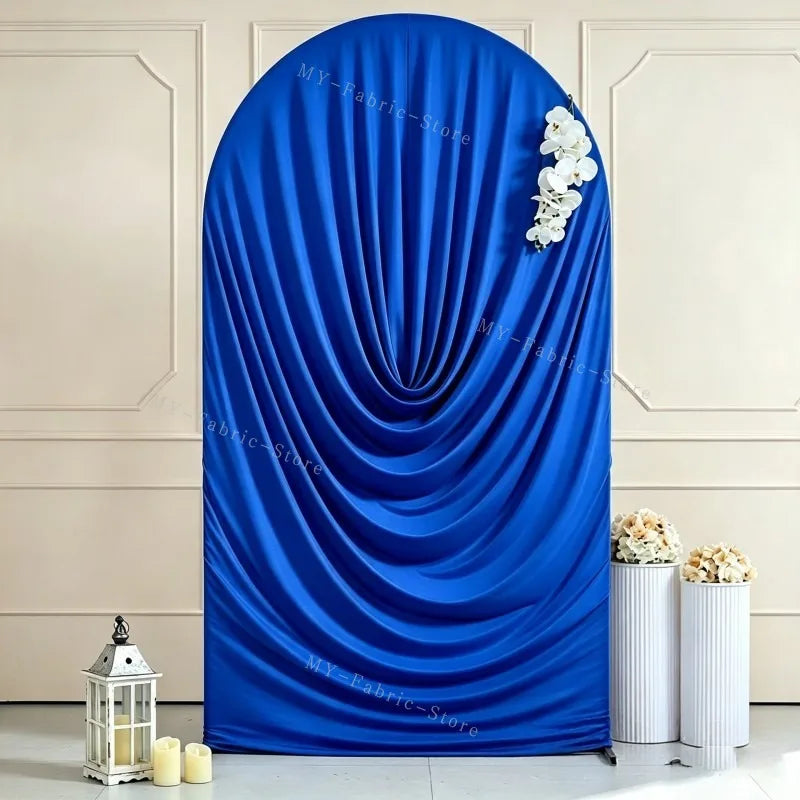 A vibrant royal blue stretchy spandex arch cover draped in soft folds, displayed against a light wall.
