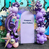 A purple and silver balloon column set decorated with a number six and birthday text against a colorful graffiti background.