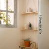 A vertical rustic wooden wall shelf with three floating shelves displaying potted plants and decorative items.
