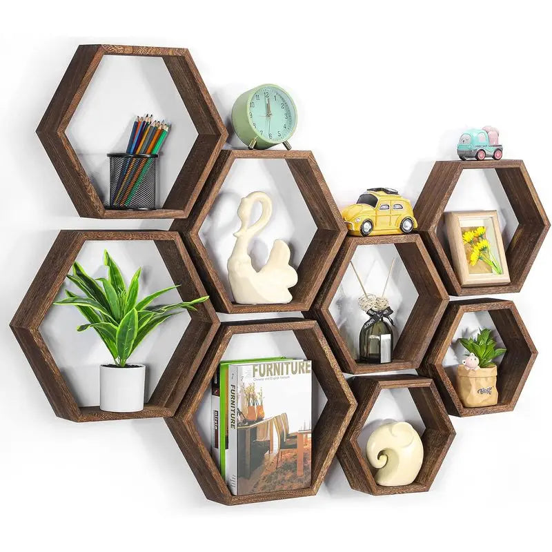 A set of four hexagonal wooden floating shelves displaying various small items like pencils, a toy car, and potted plants.