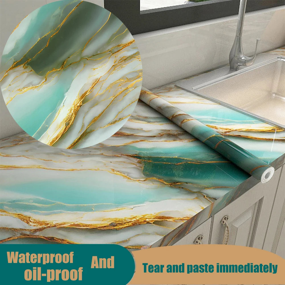 Marble pattern self-adhesive backsplash panel featuring teal and gold veining on a kitchen countertop.