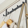 A black door and wall organizer rack with five hooks is shown against a white background.