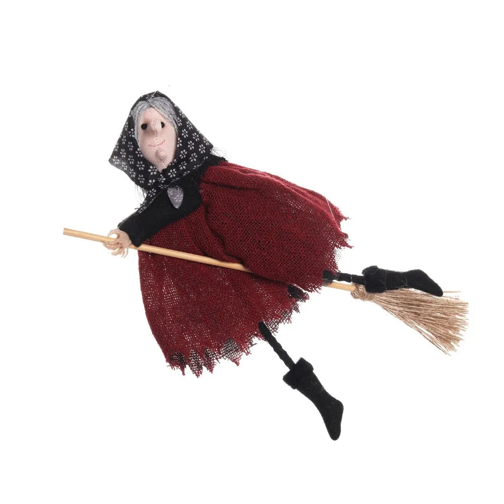A scarecrow witch ornament set featuring a figure with a white face, black hat, and a red dress holding a straw broom.