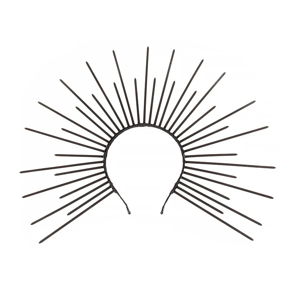 A black line drawing of a celestial halo design with radiating sun rays.