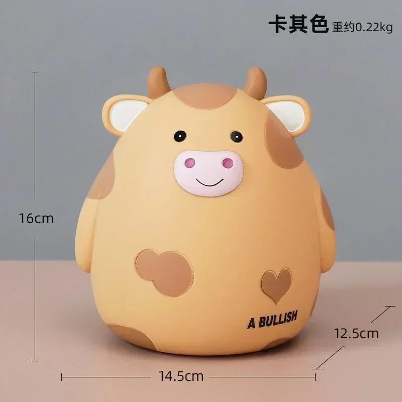 A cute, light brown cartoon cow figurine shaped like a piggy bank or coin holder.