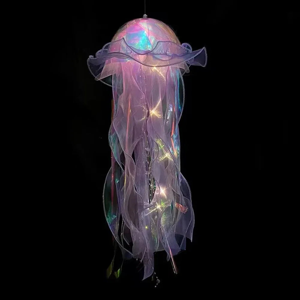 A translucent purple and pink jellyfish lantern hanging, featuring iridescent fibers and glowing accents.