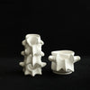 White ceramic decorative vase shaped like vertebrae