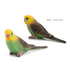 Hand-painted resin parrot figurine with yellow head and green body