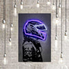 Neon motorcycle helmet canvas wall art hanging on a brick wall