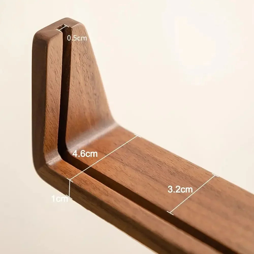 A close-up view of a walnut wood and acrylic photo frame, showing its dimensions and design.
