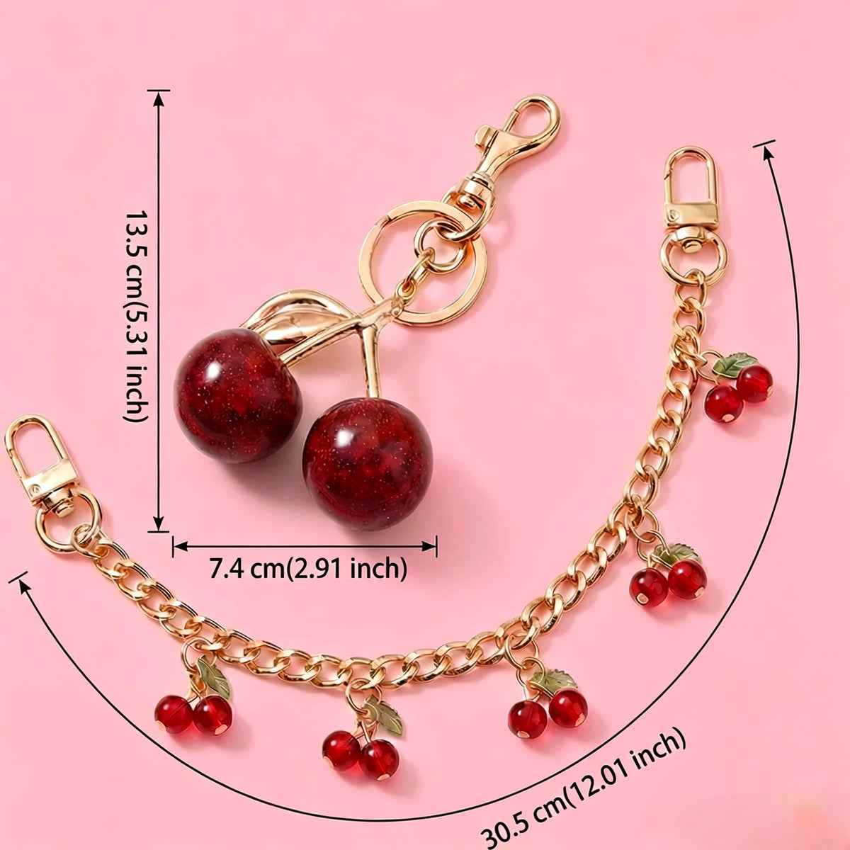 Gold chain necklace featuring red glass cherry charms and a round glass stone pendant.