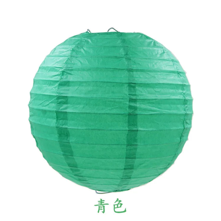 A large, round, teal green paper lantern used for parties and weddings.