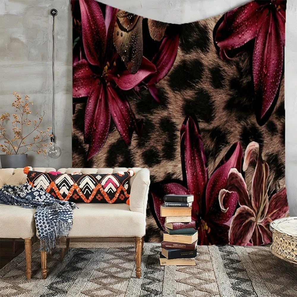 A leopard print floral tapestry wall hanging displayed above a light-colored sofa.