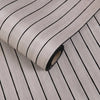 Roll of self-adhesive 3D wood grain wall panels showing parallel dark lines on a light background.