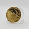 A round gold commemorative iron coin featuring a detailed crab design surrounded by decorative borders.