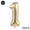 A single gold foil number balloon shaped like the number one.