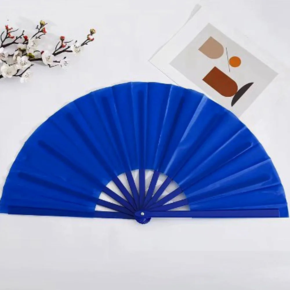A bright blue Tai Chi performance fan with durable plastic ribs is displayed on a white surface.