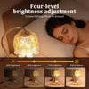 A four-level brightness adjustment lamp illuminating a woman in bed.