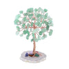 A small crystal money tree decor featuring green and clear translucent stones on a wooden branch.